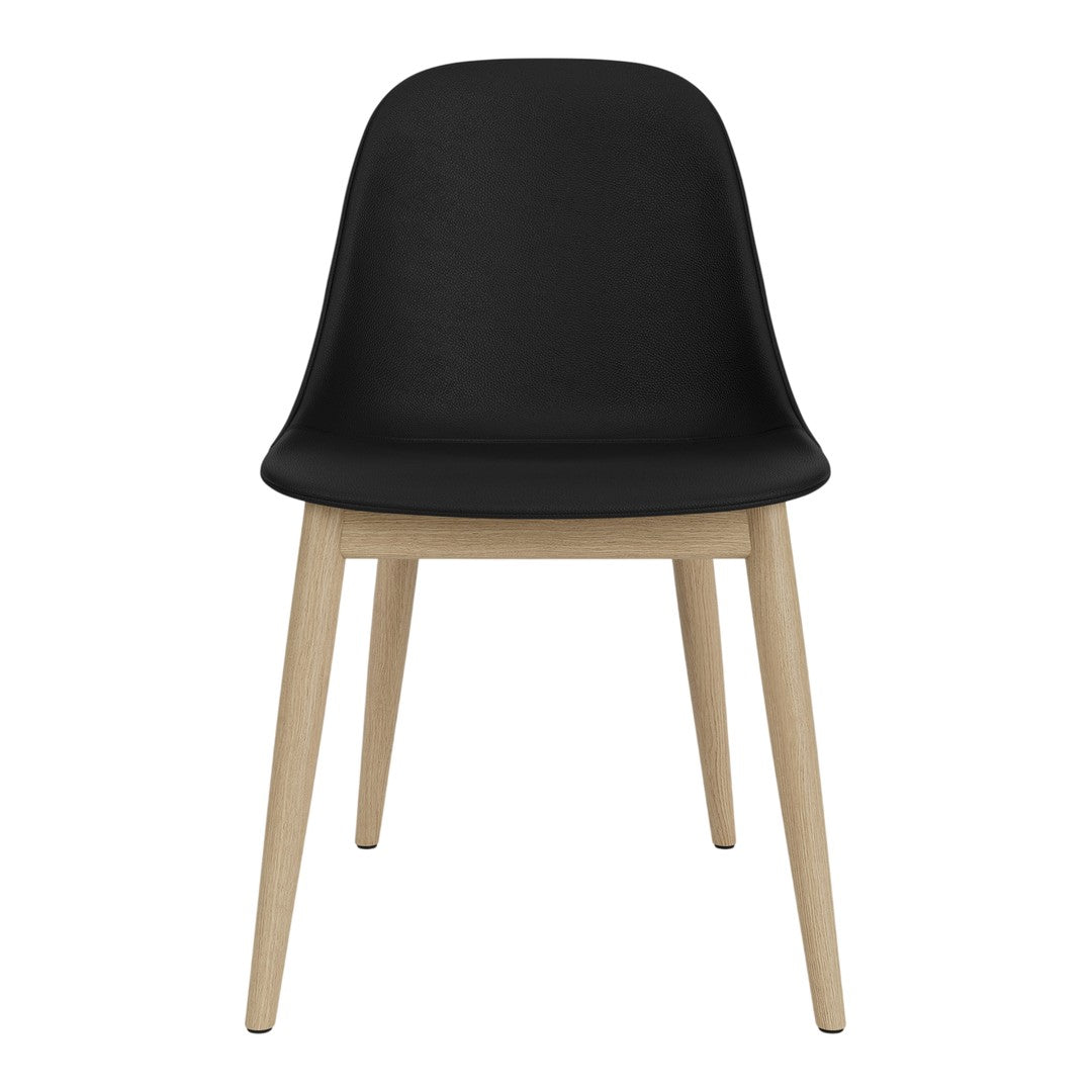 Black chair with a smooth finish, featuring natural wood legs. Modern design with minimalist style.