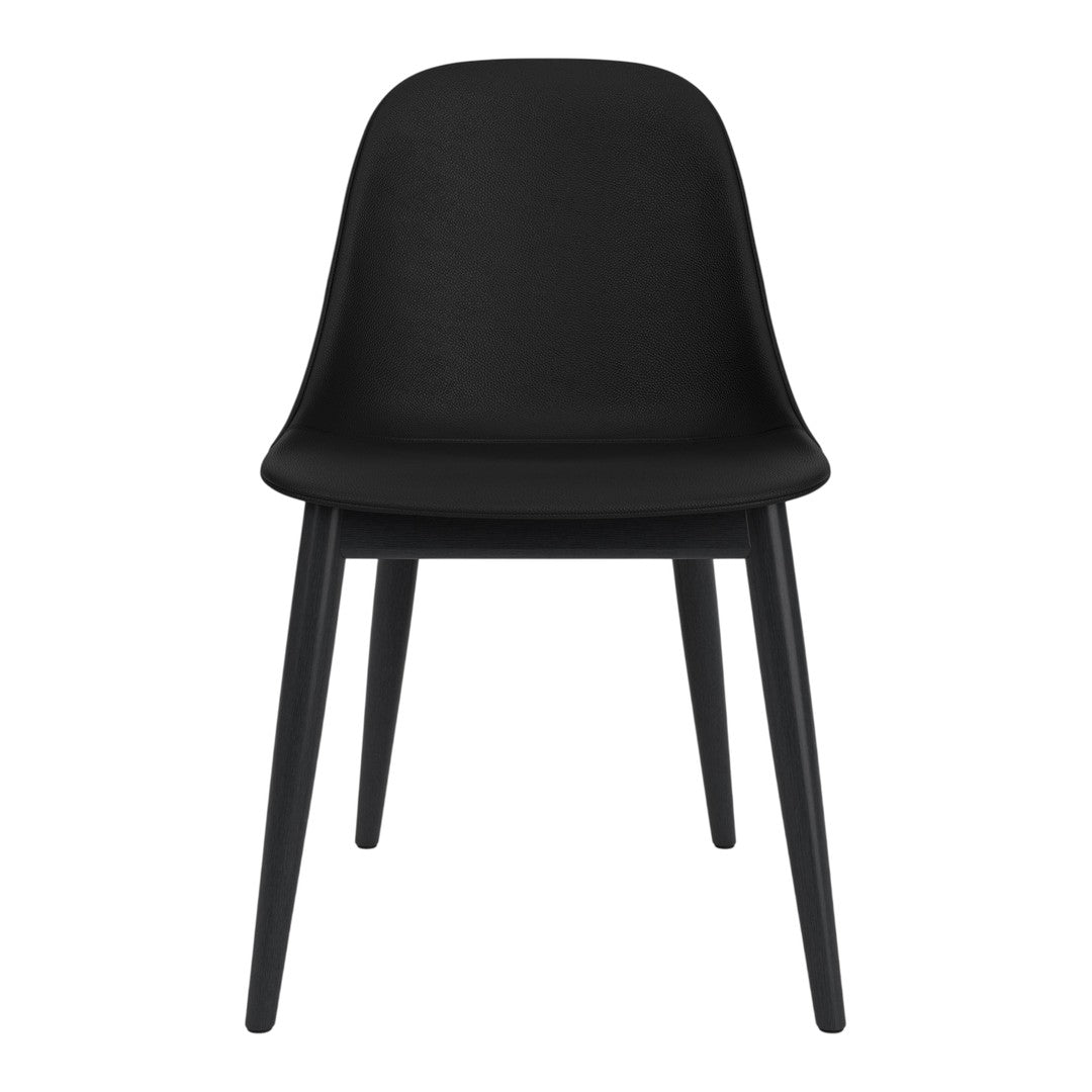 Sleek black chair with a smooth, curved design and sturdy black wooden legs. Perfect for modern interiors.