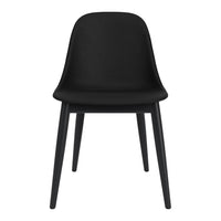 Sleek black chair with a smooth, curved design and sturdy black wooden legs. Perfect for modern interiors.