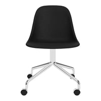 Sleek black molded chair with a minimalist design and chrome base, perfect for modern interiors.