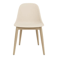 Beige chair with a smooth, matte finish and natural wooden legs, showcasing minimalist design and modern aesthetics.