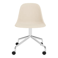 Beige fabric chair with a smooth, curved design and a sleek chrome base, featuring four black rolling casters.