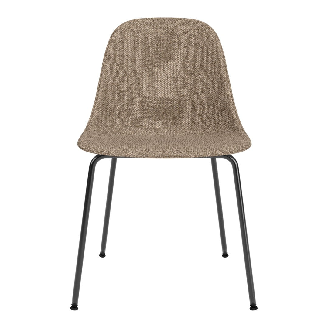 Beige textured chair with sleek black metal legs, perfect for modern interior decor.