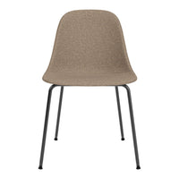 Beige textured chair with sleek black metal legs, perfect for modern interior decor.