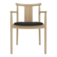 Light wood chair with a smooth finish and a contrasting black cushioned seat. Modern, minimalist design.