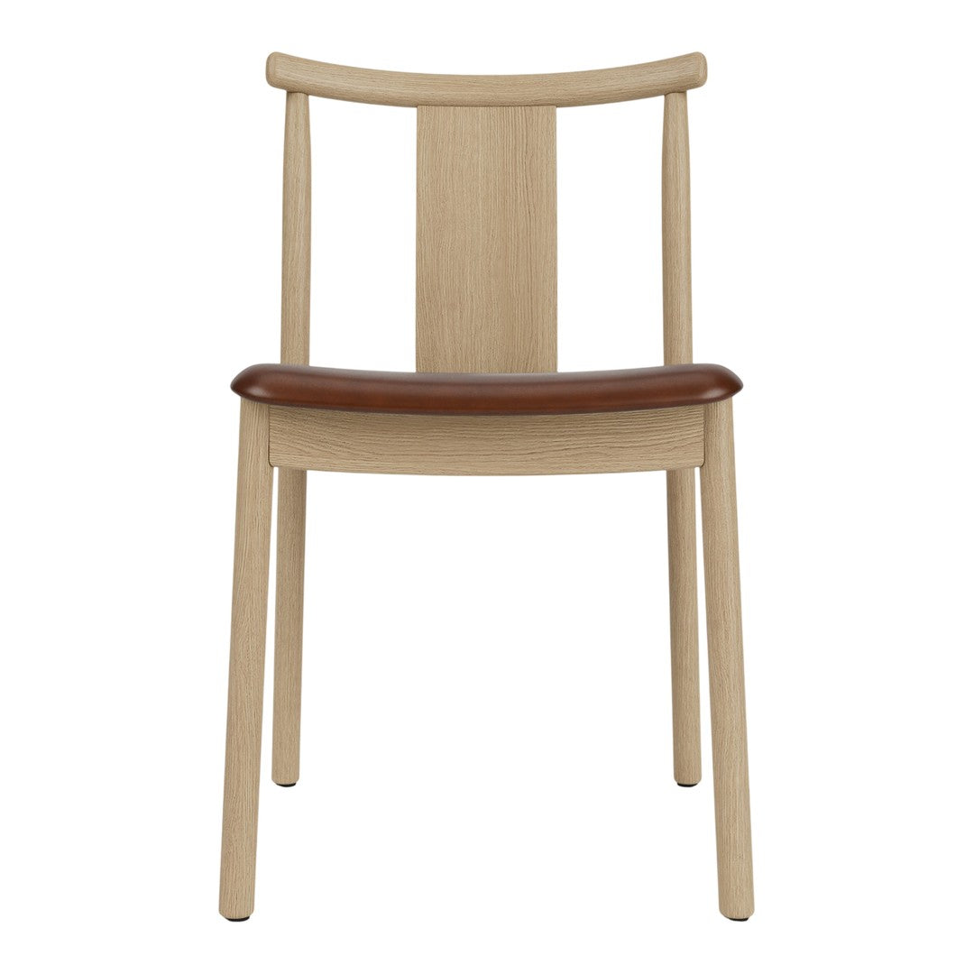 Light wood chair with a smooth, natural finish and a contrasting brown leather seat. Minimalist design, stylish and functional.