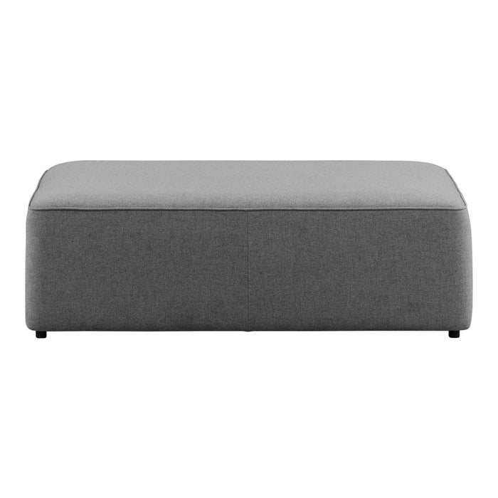 Gray upholstered ottoman with a smooth, minimalist design and subtle texture. Perfect for contemporary decor.