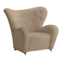 Beige upholstered armchair with curved silhouette and button-tufted detailing. Perfect for stylish living spaces.