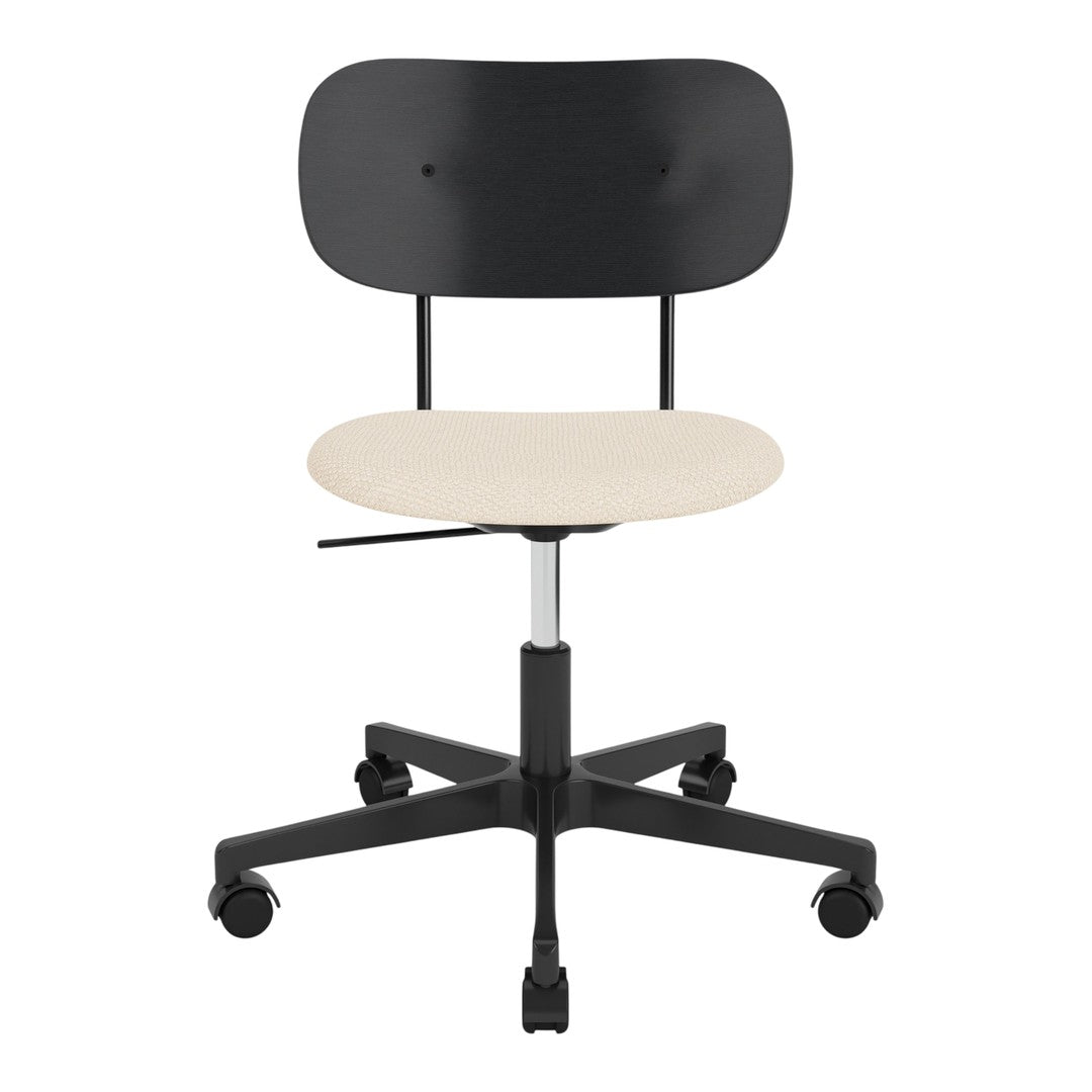 Black ergonomic office chair with a smooth beige seat and a sleek modern design. Perfect for minimalist decor.
