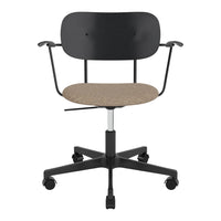 Black office chair with a textured beige seat, featuring a sleek, modern design and rolling wheels.