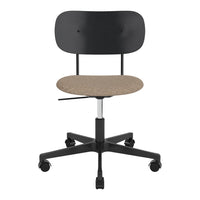 Black ergonomic chair with a textured tan seat, featuring a simple, modern design. Ideal for office or home use.