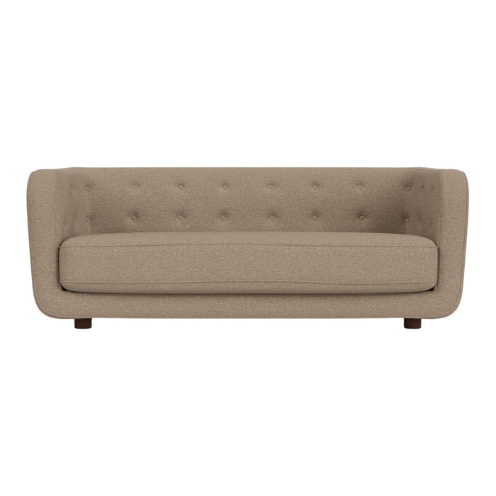 Beige tufted sofa with a smooth texture and simple, clean lines, ideal for modern decor.