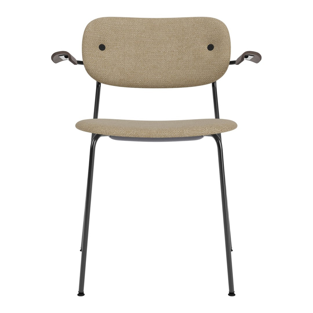 Beige upholstered chair with black metal legs and accents, featuring a smooth, minimalistic design.