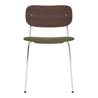 Brown wooden chair back with a green seat and chrome legs, featuring a minimalist design and smooth finish.