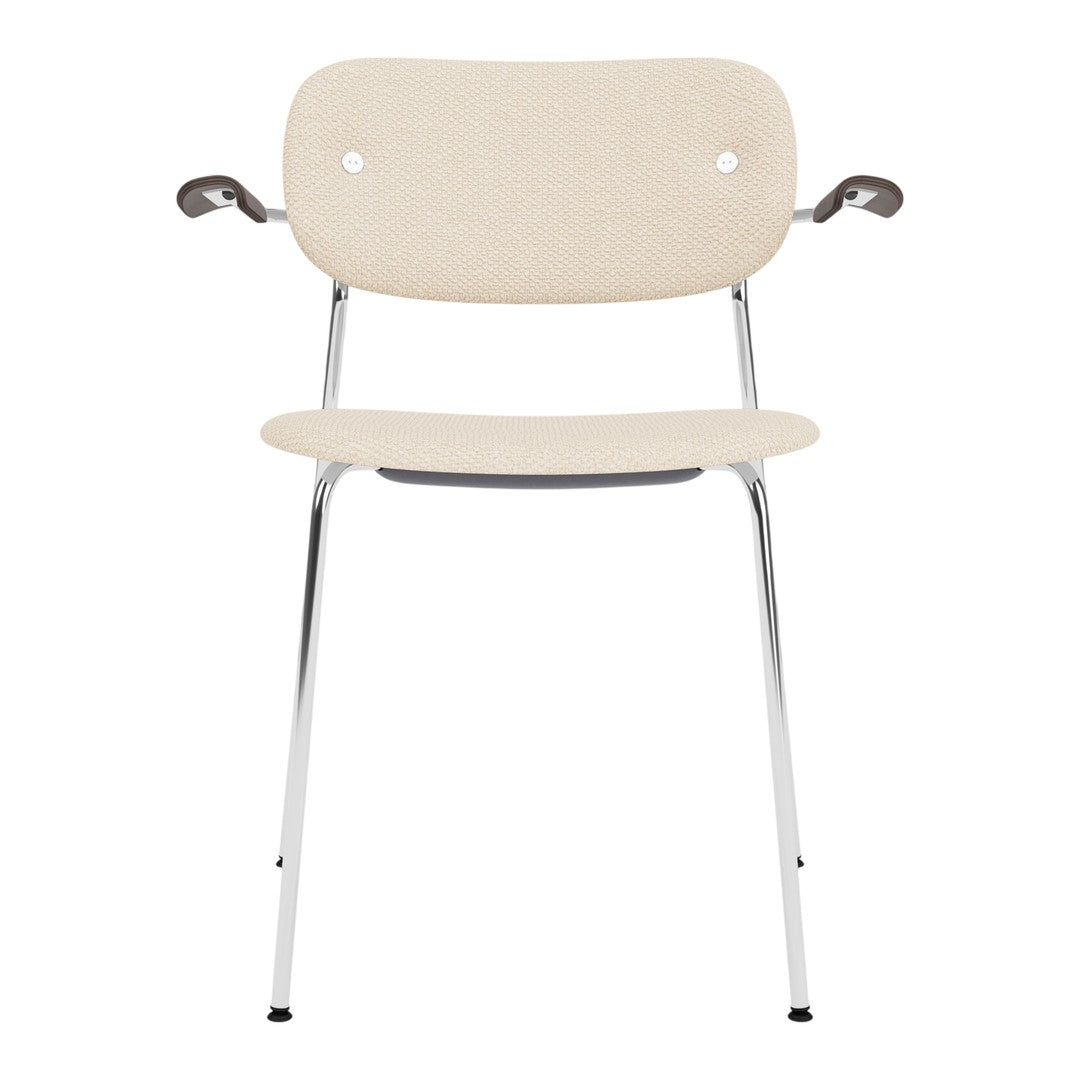 Beige fabric chair with chrome legs and armrests, featuring a minimalist design and smooth, clean lines.