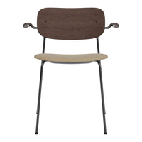 Modern chair featuring a dark wood backrest, light beige seat, and sleek black metal legs. Stylish and functional design.