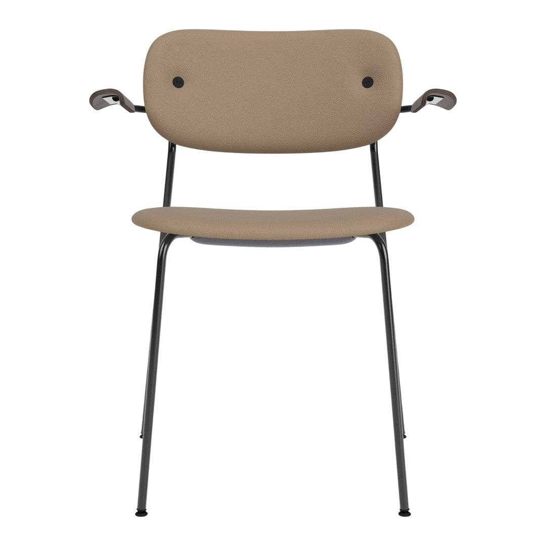 Tan chair with sleek, minimalist design and black metal legs. Smooth, solid surfaces for modern aesthetics.