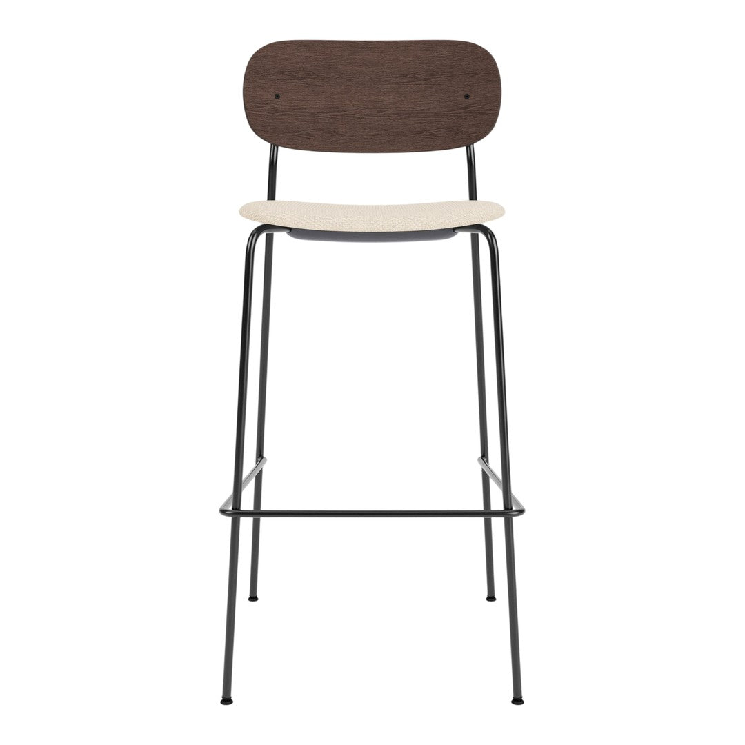 Brown wooden backrest, cream seat, and sleek black metal legs create a modern, minimalist bar stool design.