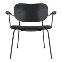 Black chair with a minimalist design featuring a smooth, rounded back and textured seat. Sleek metal legs.