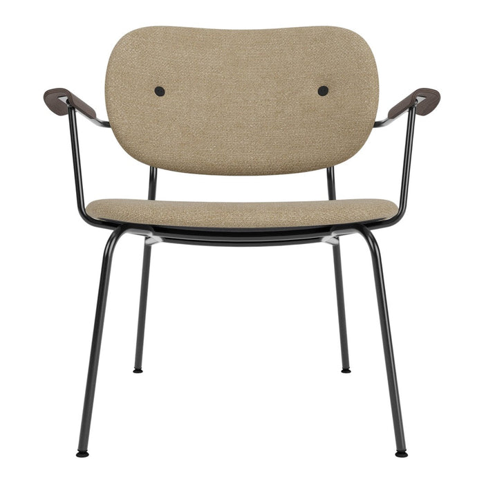 Beige upholstered chair with black metal frame and curved armrests, featuring minimalist design and subtle textures.