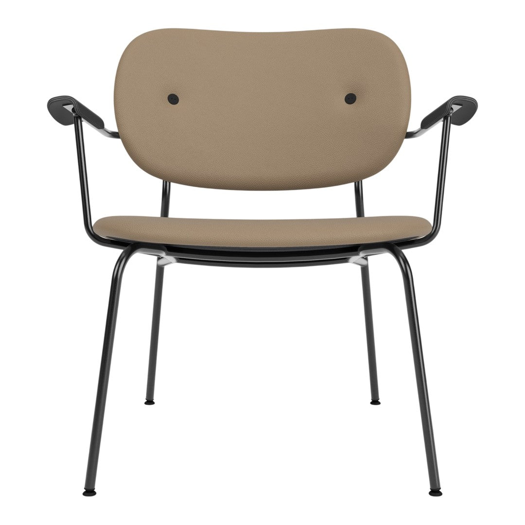 "Stylish beige chair with a smooth finish and black metal legs, featuring a minimalist design and two button accents."