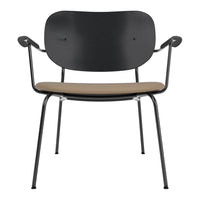 Black chair with a curved back and light brown cushioned seat, featuring a sleek, modern design.
