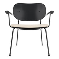 Black chair with a streamlined design and a neutral beige seat, featuring a minimalist aesthetic.