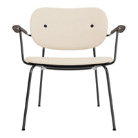 Beige fabric chair with black metal legs and arms, featuring a minimalist design and smooth, modern lines.