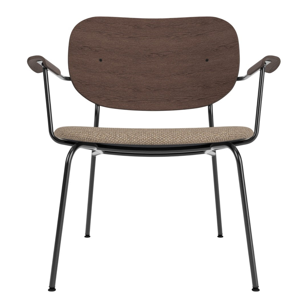 Brown wooden backrest with a beige patterned seat on a black metal frame chair. Ideal for modern decor.