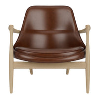 Brown leather lounge chair with a smooth finish and light wooden frame, featuring clean lines and a modern design.