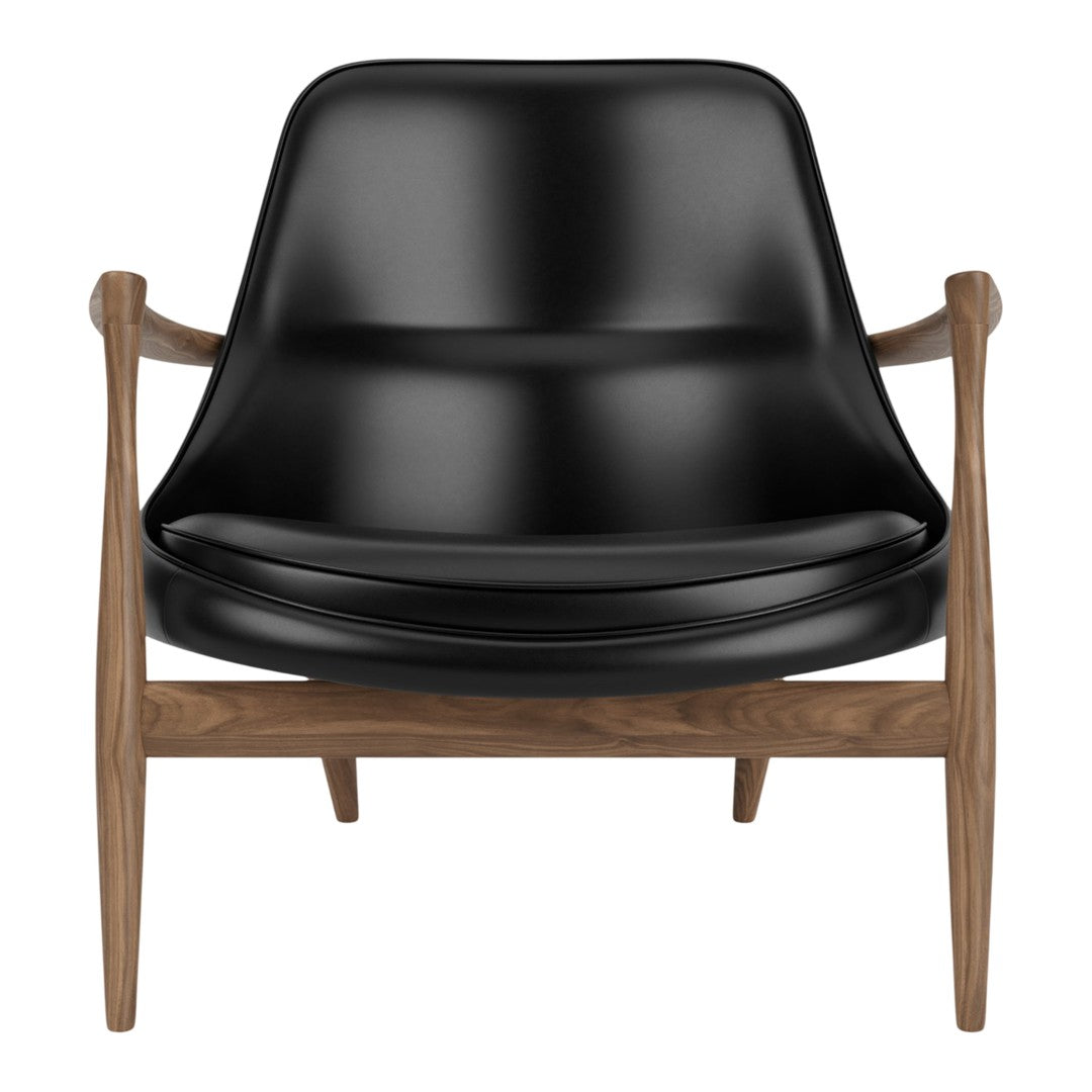 Black modern armchair with a sleek, curved seat and natural wood legs. Perfect blend of elegance and comfort.