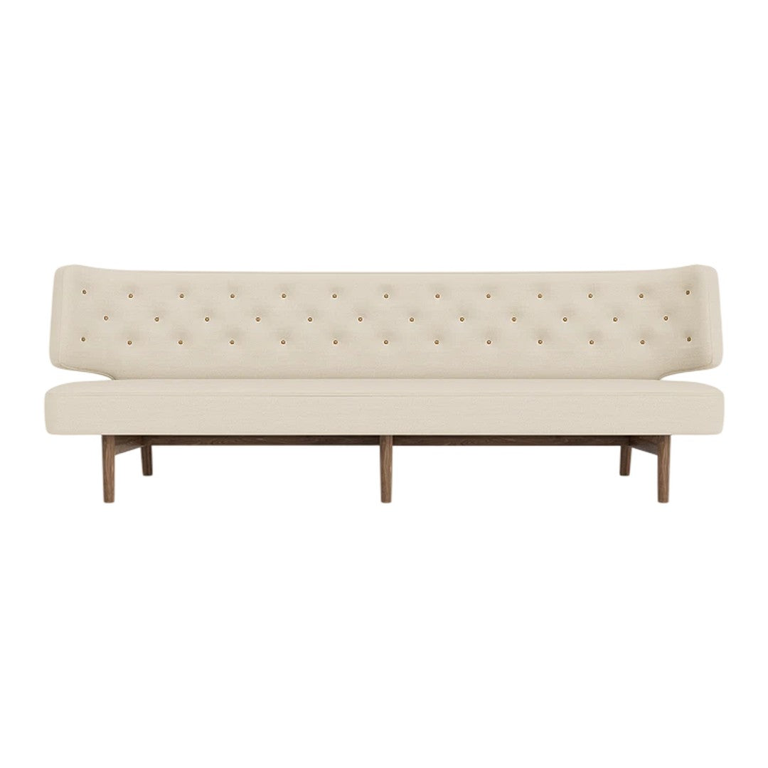 Beige tufted sofa with a smooth, minimalistic design and wooden legs for a modern touch.