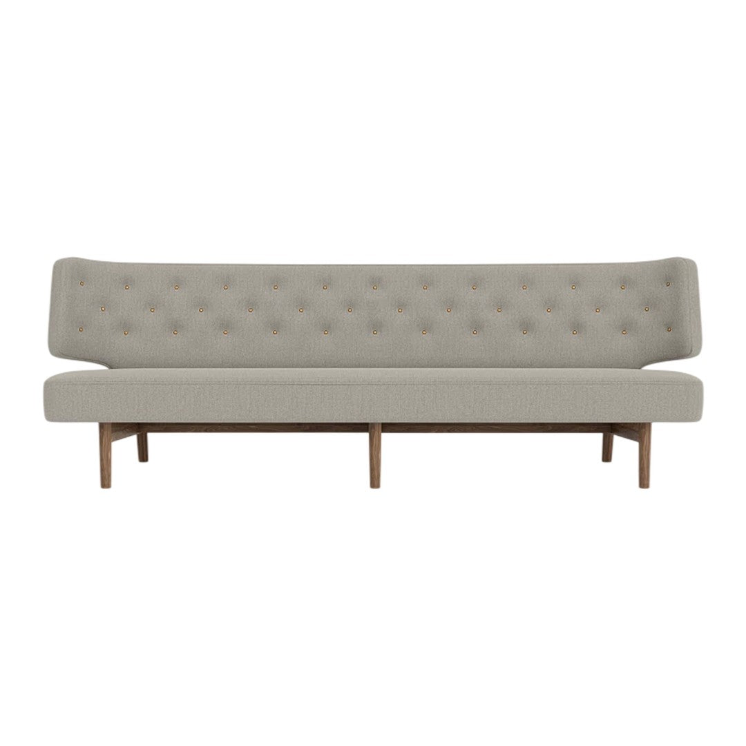 Light gray tufted sofa with a clean design and natural wood legs, featuring a minimalist aesthetic.