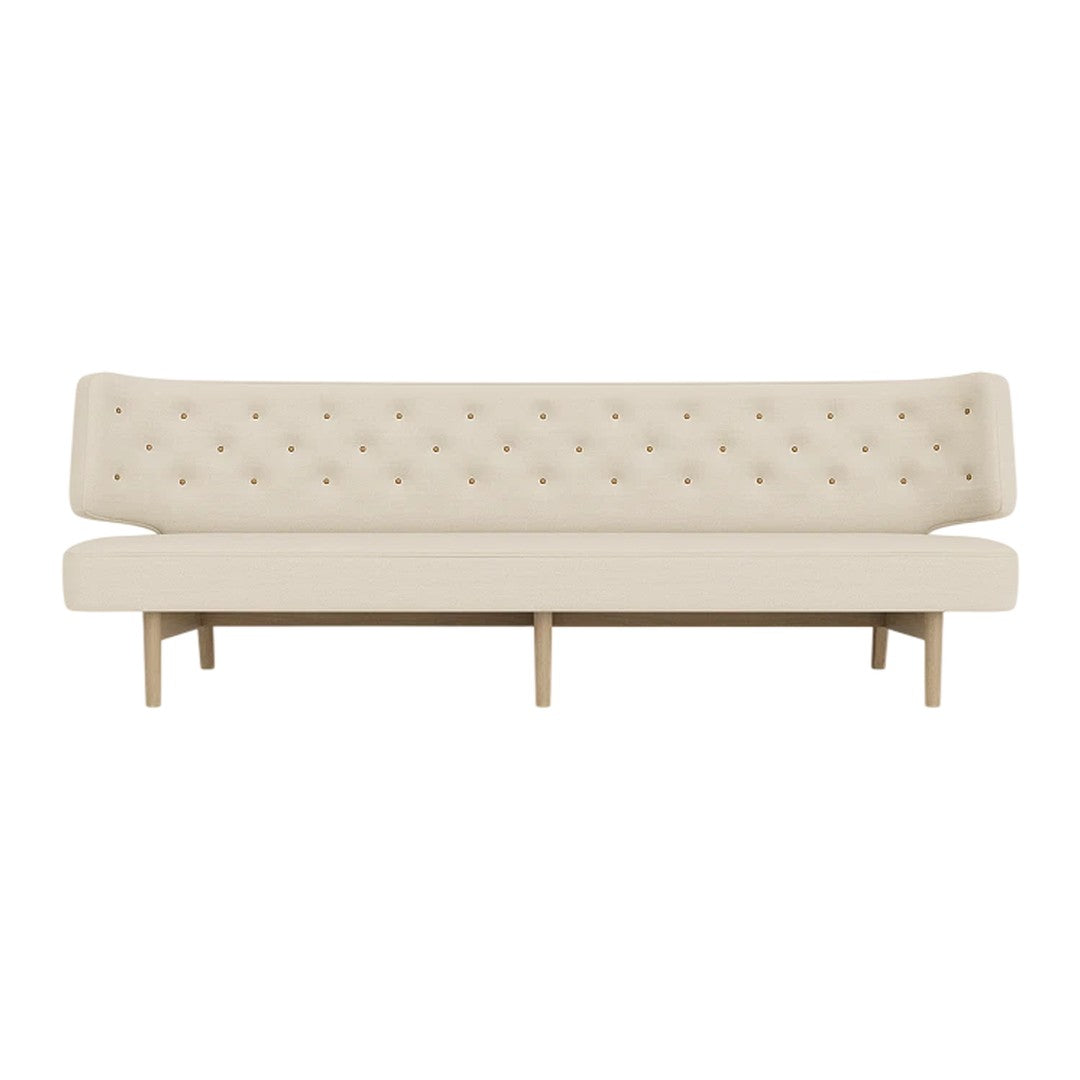 "Beige tufted sofa with a minimalist design and light wood legs, perfect for modern decor."