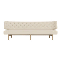 "Beige tufted sofa with a minimalist design and light wood legs, perfect for modern decor."