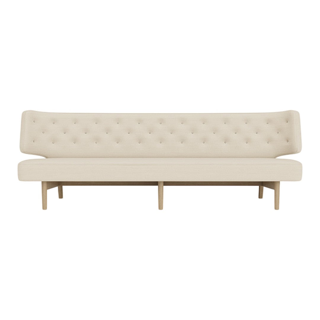 Beige tufted sofa with a minimalist design and wooden legs, perfect for modern decor.