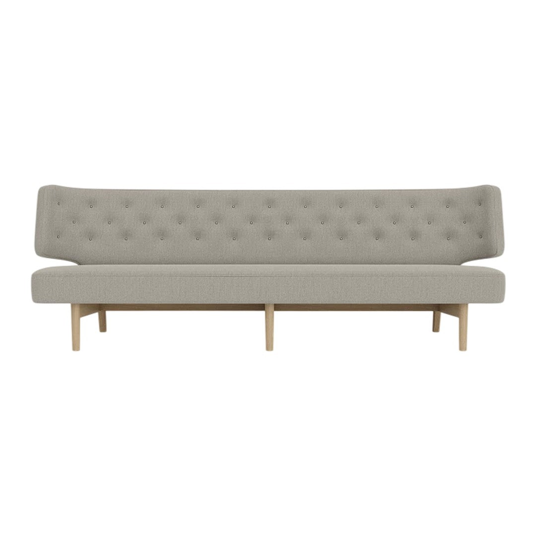 Light gray tufted sofa with a sleek design and natural wood legs, ideal for modern living spaces.
