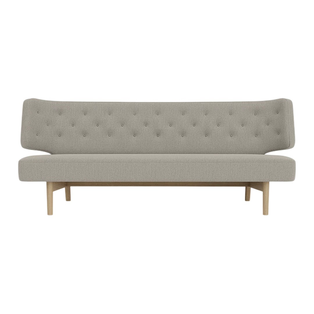 Light gray tufted sofa with a minimalist design and wooden legs, perfect for modern interiors.