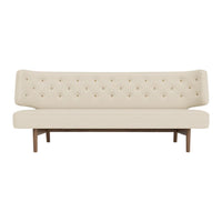 Cream-colored tufted sofa with a sleek wood base and elegant, minimalist design. Perfect for modern decor.