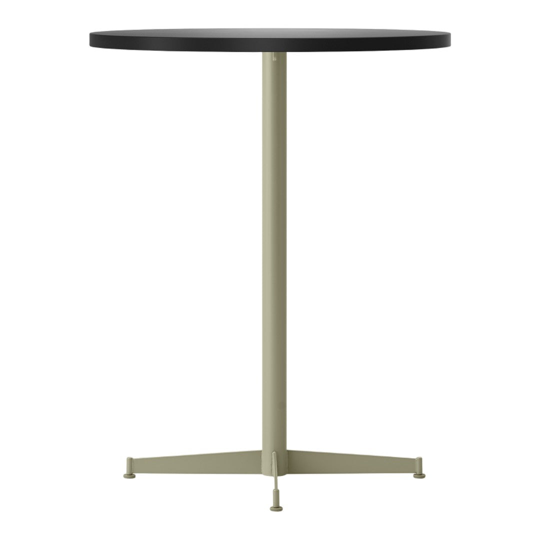 Round table with a sleek black top and a matte olive green base, featuring a minimalist design.
