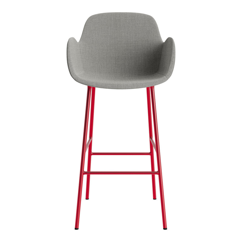 Gray upholstered bar stool with red metal legs, featuring a sleek, modern design. Ideal for contemporary spaces.