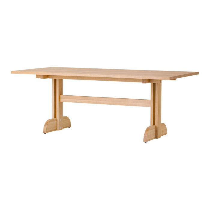 Natural wood table with a smooth, light finish and minimalistic design, featuring clean lines and a simple structure.