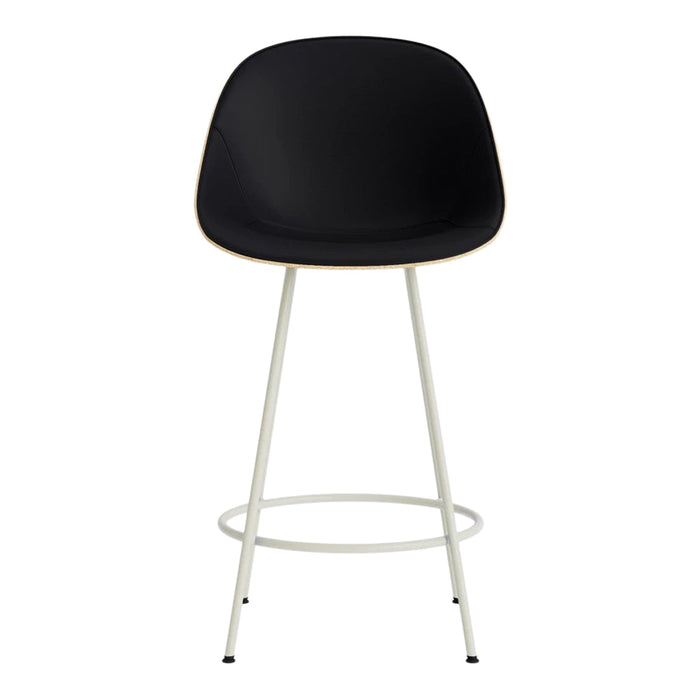 Black molded seat with natural wood trim and sleek white metal legs. Modern minimalist design for stylish interiors.