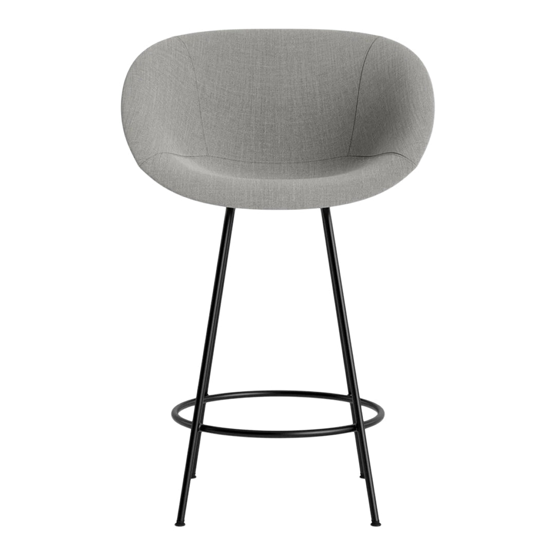 Gray upholstered barstool with smooth, rounded back and black metal legs, perfect for modern interiors.