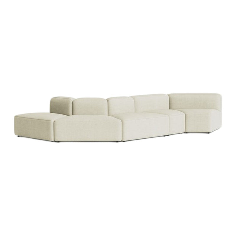 Modern sectional sofa in soft beige with a textured fabric and minimalist design, perfect for contemporary spaces.