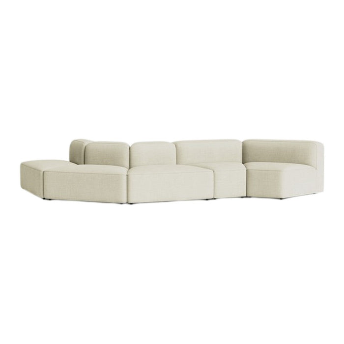 Cream-colored modular sectional sofa with a smooth, minimalist design and geometric shape.
