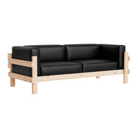 Black leather sofa with a natural wood frame, featuring a sleek, modern design and minimalist aesthetic.