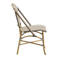 Striped beige and brown chair with polka dots on a woven seat and a light bamboo frame. Perfect for stylish seating.