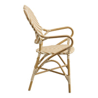 Cream and beige striped pattern on a stylish rattan chair with natural bamboo frame, perfect for indoor or outdoor settings.