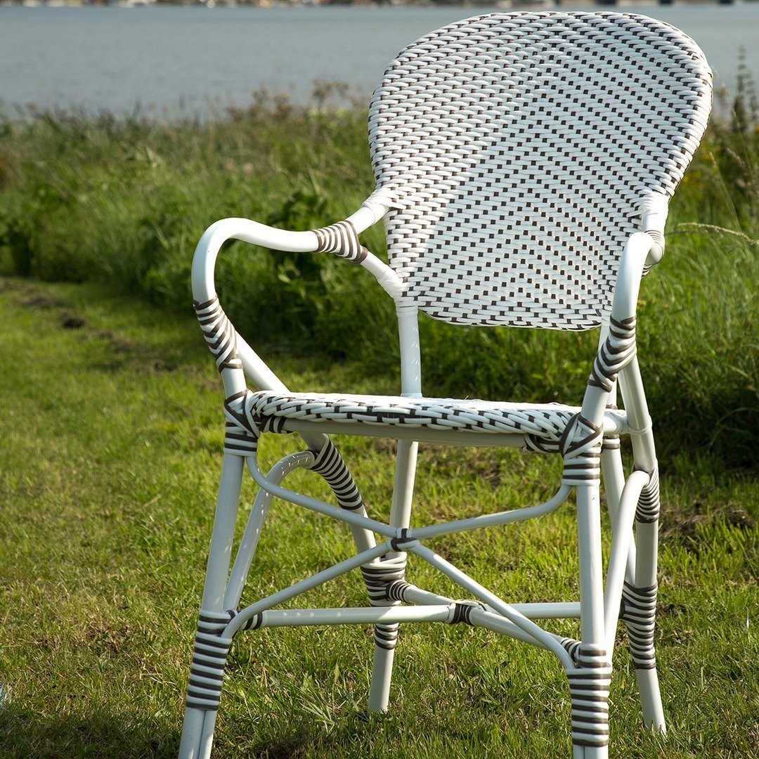White and brown woven outdoor chair with a round backrest, featuring a stylish pattern and durable construction.